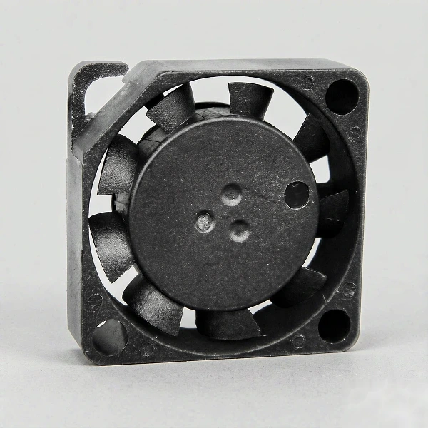 DC blower fan with centrifugal impeller and side discharge outlet in a compact square housing