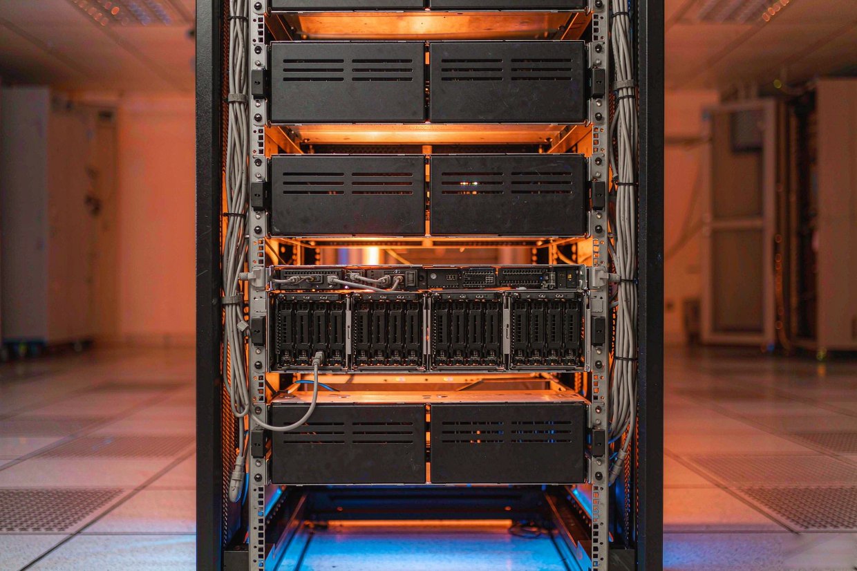Server rack airflow management with blanking panels and organized rear cabling
